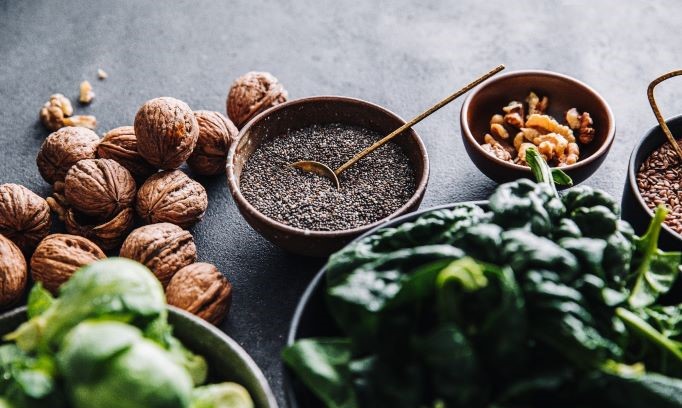 nuts and seeds in bowls on counter